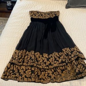 Black strapless cocktail dress with embroidered/beaded design and velvet bow